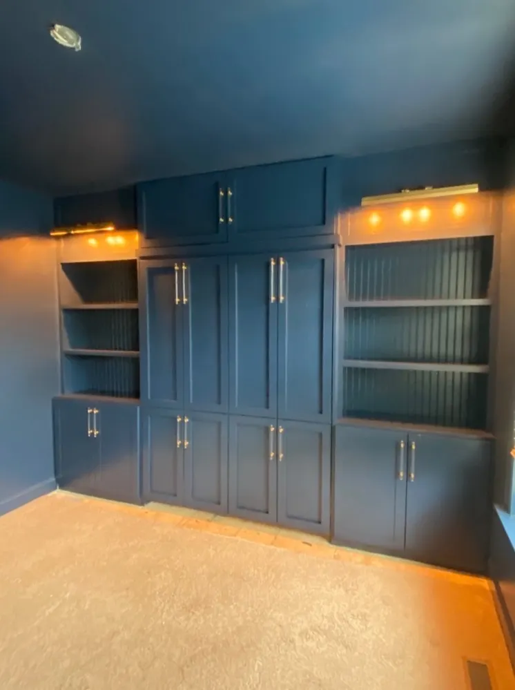 Blue painted built-in shelving and cabinetry by Alan Robinson Painting in Nashville