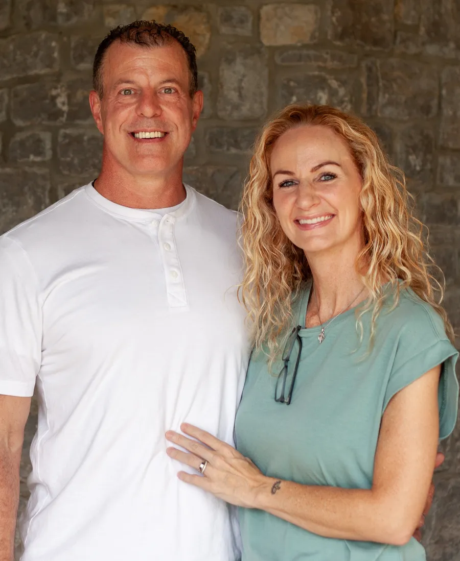 Beth Robinson smiling beside her husband Alan Robinson