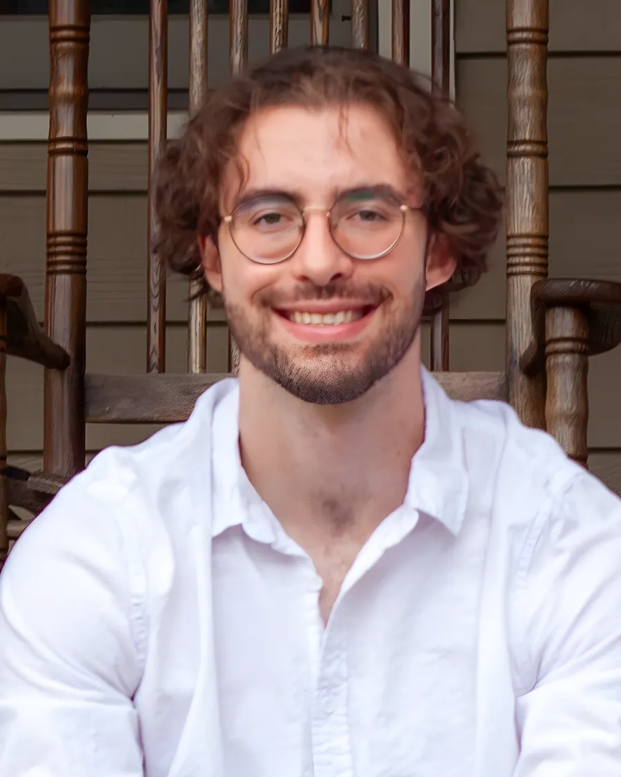 Sawyer Robinson, Alan Robinson's son, smiling on the family's front porch